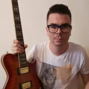 Jacob Sobolev holding his electric guitar